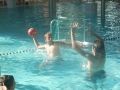 Playing waterpolo.