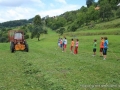 This big machine will pick up the grass for us.