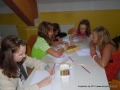 Girls are drawing signs for their bathroom too.