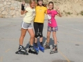 Girls rollerblading.