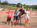Playing tennis.